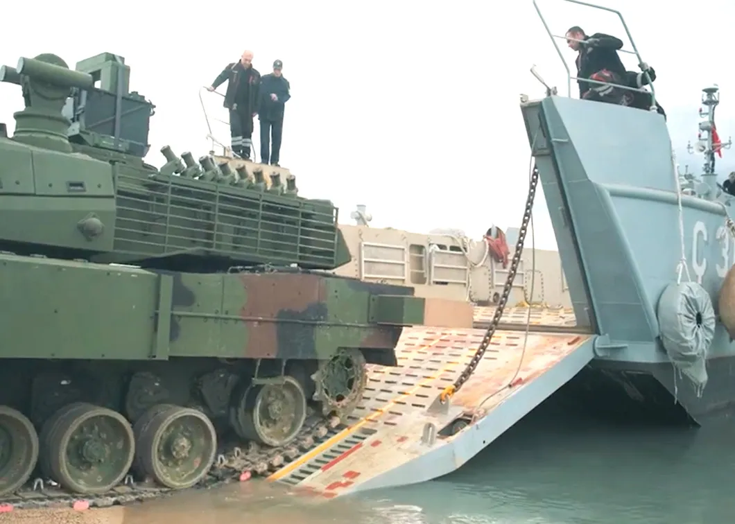 Tank driving off an LCM ramp