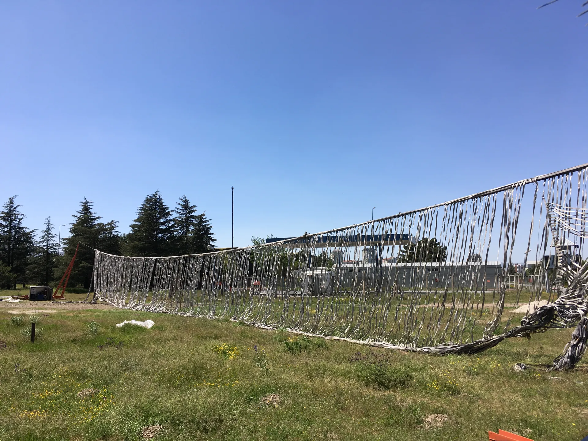 Net raised across the runway by the hydraulic lifting units
